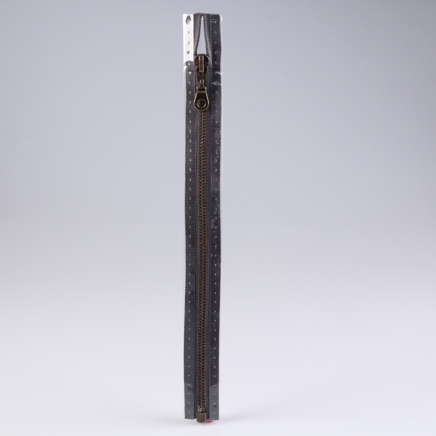 Reissverschluss M5, mit messingfarbener Metallschiene, lang, teilbar